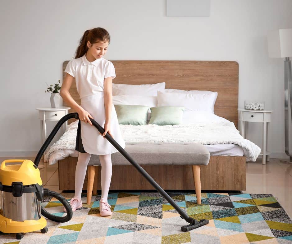 Person Cleaning a Bedroom