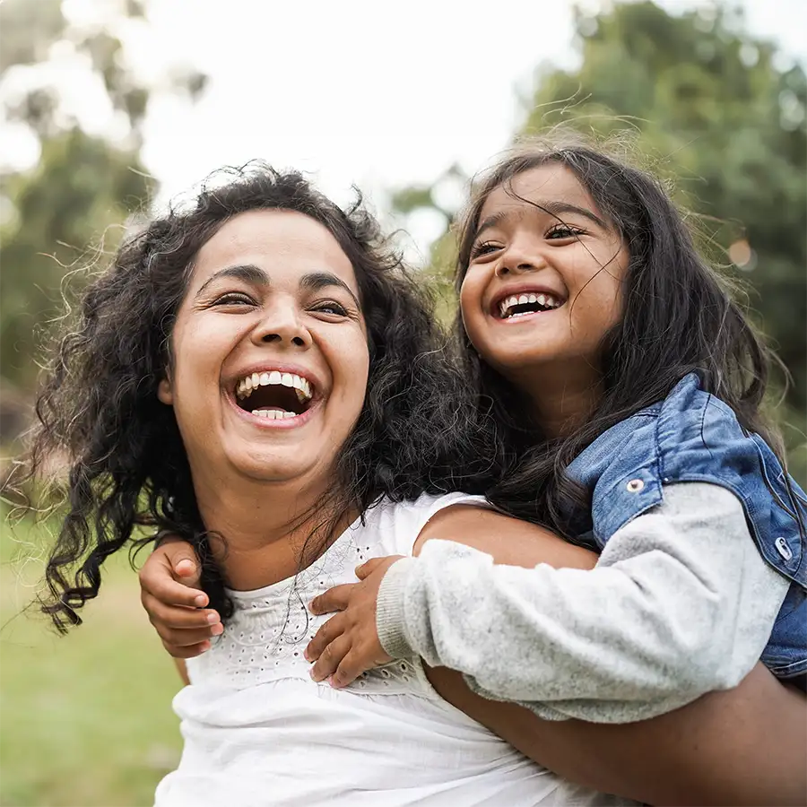 Mother and Daughter are laughing and smiling - get back to your daily life after super effective lice treatment - Chesterfield, MO